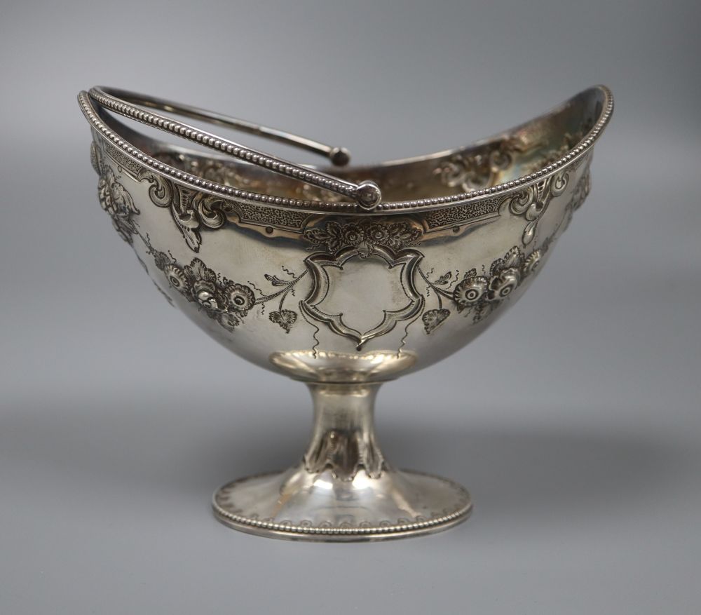 A Victorian embossed silver boat shaped sugar basket (lacking liner), Martin, Hall & Co, Sheffield, 1868, 15.8cm.